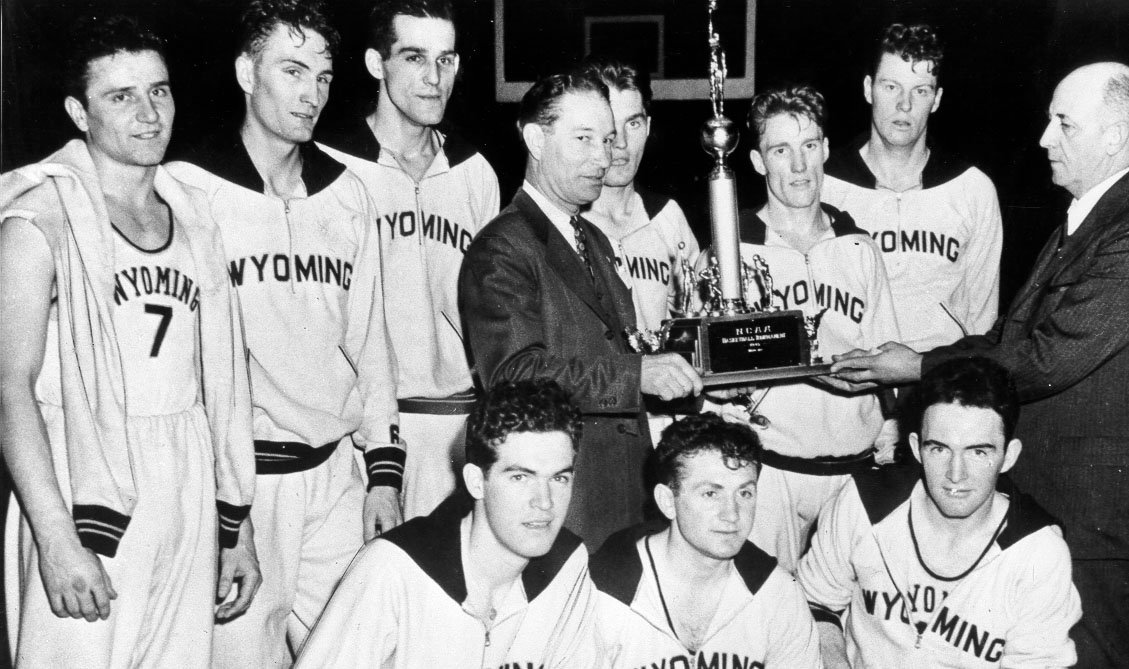 The Wyoming Cowboys being presented with the 1943 NCAA Championship trophy.  Two days later, they would defeat St. John's in the first NCAA-NIT faceoff for the "mythical national championship".