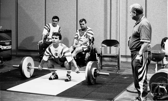 Ivan Abadjiev, father of the 'Bulgarian Method', watching his greatest weightlifting protege, Naim Suleymanoglu, attempt a lift.